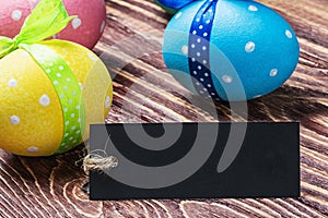 Colorful painted easter eggs and black label labeling