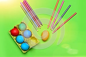Colorful painted easter eggs with pencil set in box