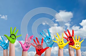 Colorful painted hands with smileys photo