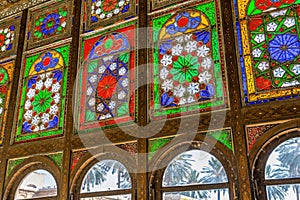 Colorful painted tiles on the window of Zinat-ol Molk House belonged to Qavam-ol Molk family, Medieval Persian mansion with