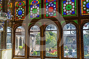 Colorful painted tiles on the window of Zinat-ol Molk House belonged to Qavam-ol Molk family, Medieval Persian mansion with