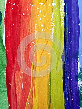 Colorful painting rainbow texture of red, yellow, green, blue stripes with white paint drops