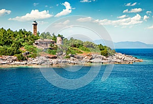 Colorful panoramic view of old Venetian lighthouse. Slpendid morning seascape of Ionian Sea. Wonderful outdoor scene of Kefalonia