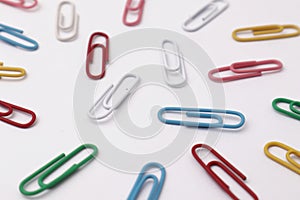 Colorful paper clip office business supplies isolated on white