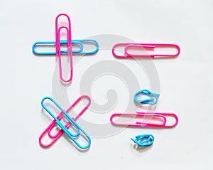 Colorful paper clip on white background. stationery office.