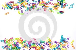 Colorful paper clips isolated on white background with copyspace. Back to school concept