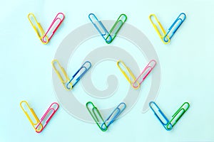 Colorful paper clips stuck together in a heart shape. Concept of human diversity, equality, and unity.