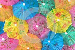 Colorful paper cocktail umbrella close-up