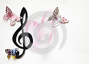 Colorful paper cut out butterflies with a musical treble cleff and a handrawn pink heart