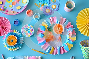 Colorful paper flowers on blue background. Ai generated