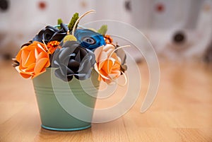 Colorful Paper Flowers in a small bucket