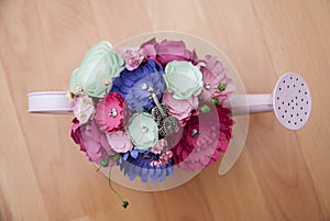 Colorful Paper Flowers in a small pink handshower