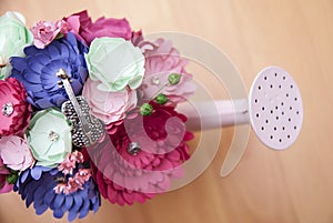 Colorful Paper Flowers in a small pink handshower