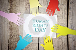 Colorful paper hands with Human Rights Day text