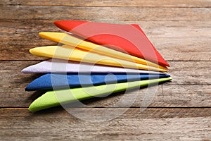 Colorful paper napkins on wooden background