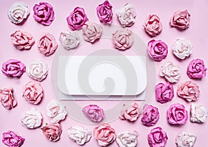 Colorful paper roses with envelopes, Valentine's Day frame ,with text area on paperrustic background top view close up