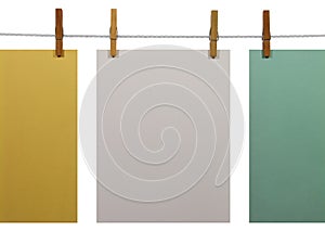 Colorful paper sheets on a clothes line (+clipping path)