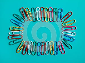 Colorful paperclip on blue pastel background