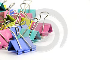 Colorful paperclips on white.