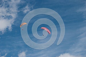 Colorful paraglidings against clear blue sky