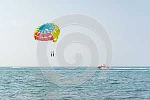 Colorful parasail wing pulled by a boat in the sea water - Alanya, Turkey