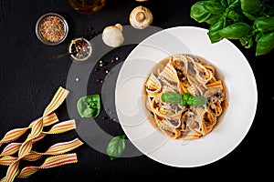 Colorful Pasta pappardelle with mushrooms in cream sauce. photo