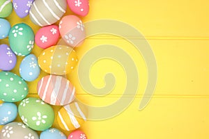 Colorful pastel Easter Egg side border against a yellow wood background