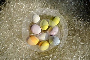 Colorful pastel Easter eggs in basket close-up. Top view. easter holidays card