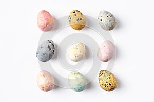 Colorful pastel Easter eggs on white background.