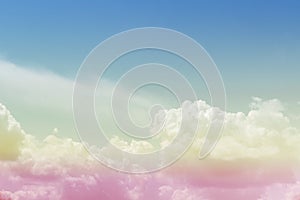 Colorful pastel sunrise or sunset sky with puffy fluffy white clouds