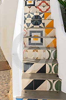 Colorful pattern mosaic tiles on stairs in Dalt Vila Ibiza