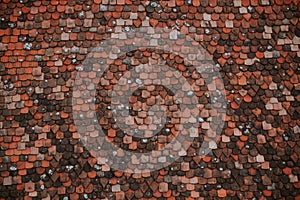 Colorful pattern of tiles on the roof. Medieval castle roof tiles texture.