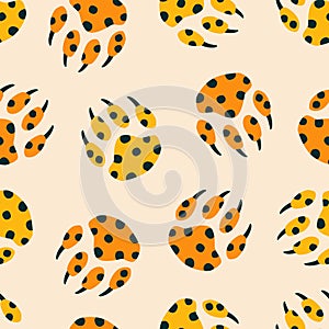 Colorful paws of wild big cat hand drawn vector illustration.Vintage leopard print seamless pattern for fabric.