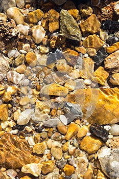 Colorful pebbles under water sea for the background