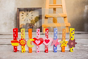 Colorful peg on wooden