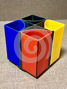 Colorful pen stand in the wooden table