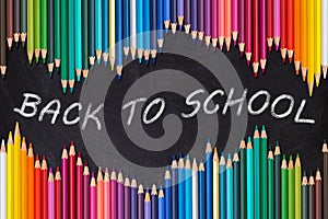 Colorful Pencils on BlackBoard Back to School Concept
