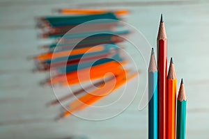 Colorful pencils Lined up, low, vertical On a blurred background