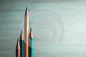 Colorful pencils Lined up, low, vertical On a blurred background