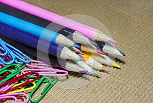 Colorful pencils and paper clips