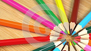Colorful pencils rotate as sun rays background. Rainbow pencils for drawing. Assortment of colored pencils. Back to
