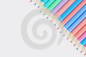Colorful pencils in row on white background with copy space, 3d render