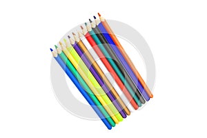 Colorful pencils or wooden crayons arranged in a row are isolated on a white background. Back to school and education concep