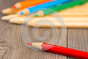 Colorful pencils on wooden rustic table