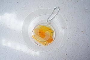 Colorful pendant painted in watercolor on a white background