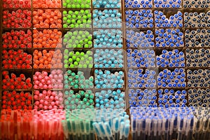 Colorful pens on display boxes in a stationery store