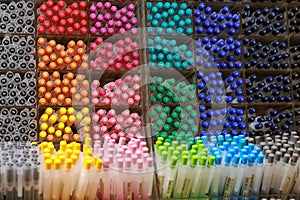 Colorful pens on display boxes in a stationery store