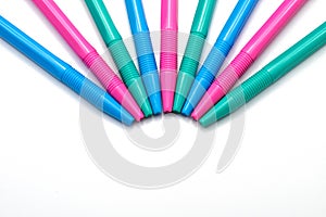 Colorful pens isolated on white background.