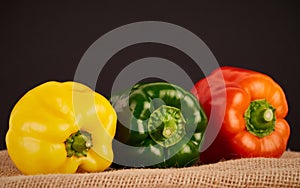 Colorful peppers on rustic background