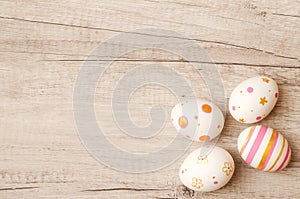 Colorful perfect handmade painted easter eggs on a wood background